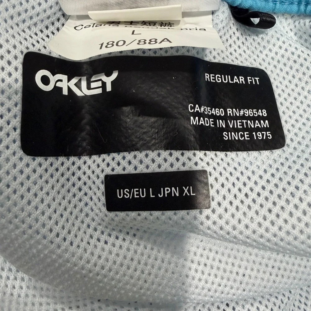 Oakley Swim Trunks Men‎ L Light Blue Excellent Tropical Toucan Print Mesh Lined